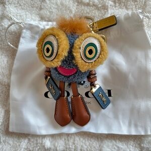 Pre-owned! Coach Coachies Winkie Bag Charm In Shearling & Leather With Horse Tag
